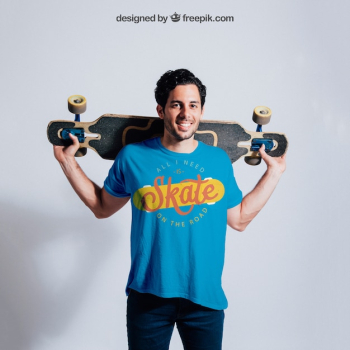 Happy skater posing with skateboard