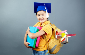 Happy student with his backpack and books Happy student with his backpack and books