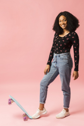 Happy woman with skateboard studio shot Free Photo Happy woman with skateboard studio shot Free Photo