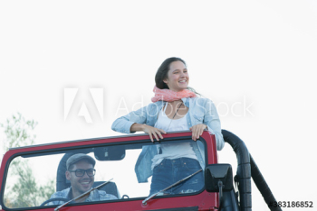 Happy young couple in jeep Happy young couple in jeep