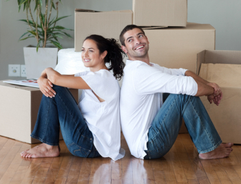 Happy Young Couple Moving House Happy Young Couple Moving House