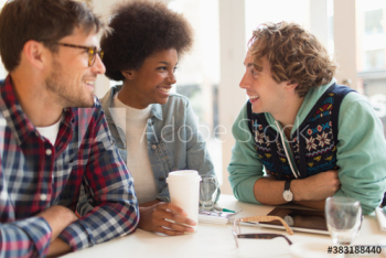 Happy young friends drinking coffee in cafe Happy young friends drinking coffee in cafe