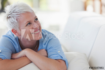Happy young woman laying on sofa Happy young woman laying on sofa
