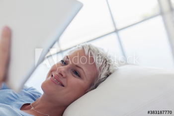 Happy young woman using digital tablet Happy young woman using digital tablet