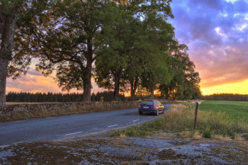 Hatchback On Road During Sunset Hatchback On Road During Sunset