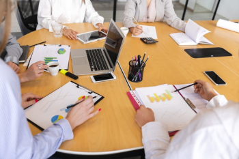 High angle corporate desk with electronic devices Free Photo