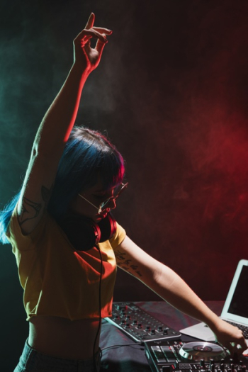 High angle dj woman at control panel Free Photo