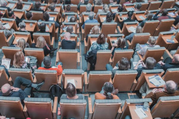 high-angle photography of group of people sitting at chairs high-angle photography of group of people sitting at chairs