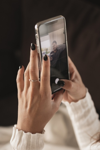 High angle woman holding mobile mock-up Free Photo