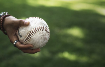 Holding Softball In Grassy Park Holding Softball In Grassy Park
