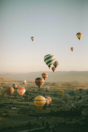 Hot Air Balloons Flying in the Sky in Cappadocia, Turkey Hot Air Balloons Flying in the Sky in Cappadocia, Turkey