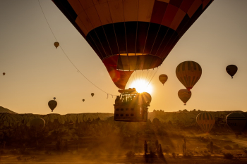 Hot Air Balloons in Mid Air during Golden Hour Hot Air Balloons in Mid Air during Golden Hour