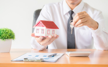 House key in home insurance broker agent's hand protection Free Photo House key in home insurance broker agent's hand protection Free Photo