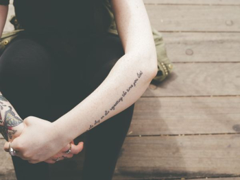 human hand with black tattoes human hand with black tattoes
