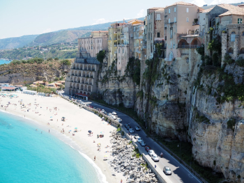 I took this photo in the beautiful Italian town of Tropea, two years ago. The city is towering above the beach, a unique scene!