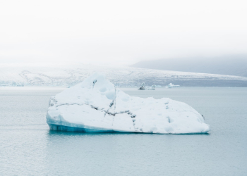 Iceberg Drifting On Icy Water Iceberg Drifting On Icy Water
