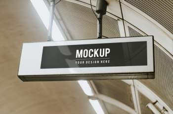 Indoor board mockup hanging from a ceiling Free Psd