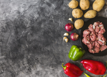 Ingredients for making raw meat on grunge wallpaper texture background