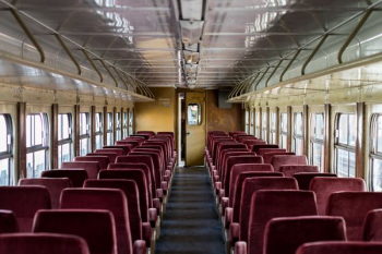 interior of train with red chairs interior of train with red chairs