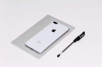 iPhone 8 Plus and a notebook iPhone 8 Plus and a notebook