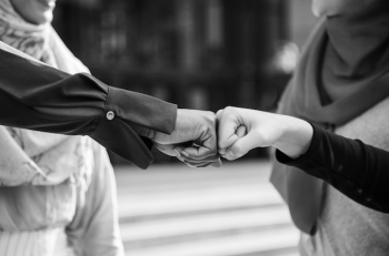 Islamic women friends fist bumps Islamic women friends fist bumps