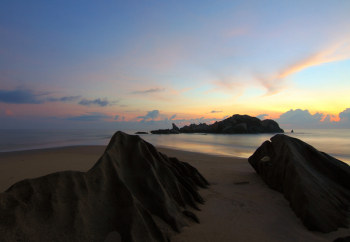 Island on Sea Under Blue Sky at Golden Hour