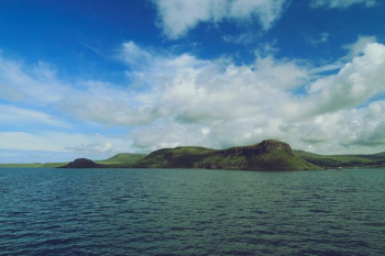 island under blue sky island under blue sky