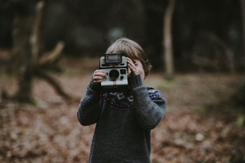 kid holding camera kid holding camera
