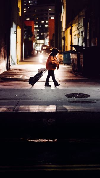 kid standing while carrying luggage kid standing while carrying luggage