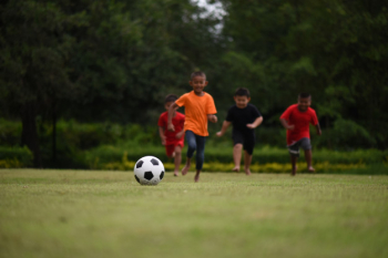 Kids playing soccer football Kids playing soccer football