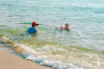 Kids Swimming At The Beach Kids Swimming At The Beach