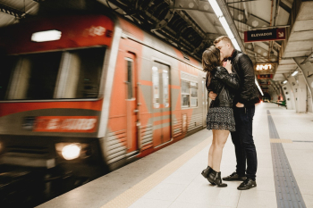 Kissing Couple Beside Running Train in Subway Kissing Couple Beside Running Train in Subway