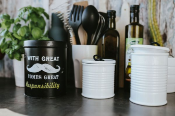 Kitchen utensils and cans by the wall Kitchen utensils and cans by the wall
