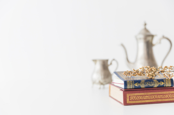 Koran with branch and tea utensil