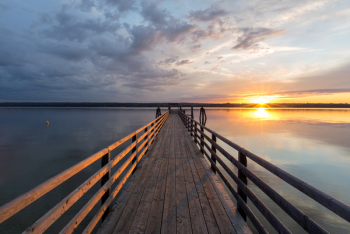 Landing pier at sunset at Lake Ammersee, Breitbrunn, Bavaria, Germany