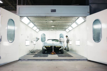 landscape photography of silver muscle car in hangar landscape photography of silver muscle car in hangar