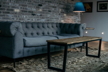 Large Grey Sofa By Brick Wall Large Grey Sofa By Brick Wall