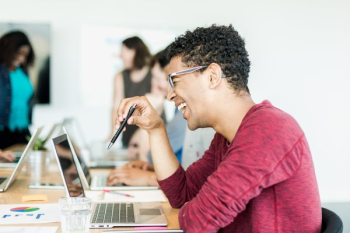 Laughing Man Holding Pen In Meeting Laughing Man Holding Pen In Meeting