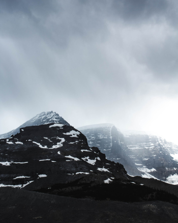Light rays penetrate the clouds above Jasper's sub-zero temperature glaciers.