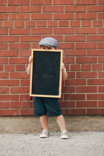 Little Boy Holding Blank Chalkboard Little Boy Holding Blank Chalkboard