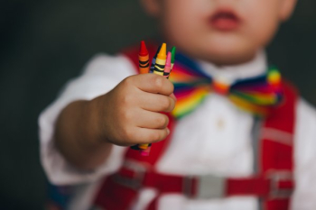 Little Boy Holding Crayons Little Boy Holding Crayons