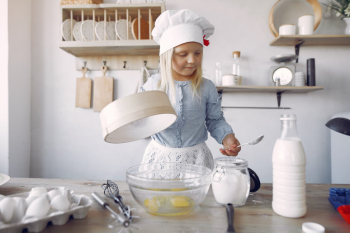 Little girl in a white shef hat cook the dough for cookies Free Photo Little girl in a white shef hat cook the dough for cookies Free Photo