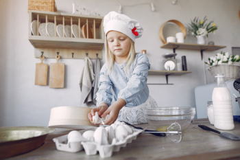 Little girl in a white shef hat cook the dough for cookies Free Photo Little girl in a white shef hat cook the dough for cookies Free Photo