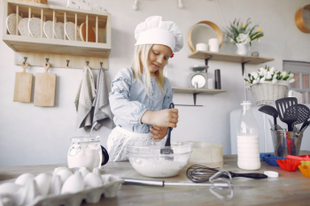 Little girl in a white shef hat cook the dough for cookies Free Photo Little girl in a white shef hat cook the dough for cookies Free Photo