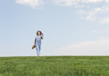 Long shot girl with long hair running on grass Free Photo Long shot girl with long hair running on grass Free Photo
