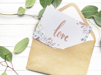 Love Text on White Paper With Brown Envelope