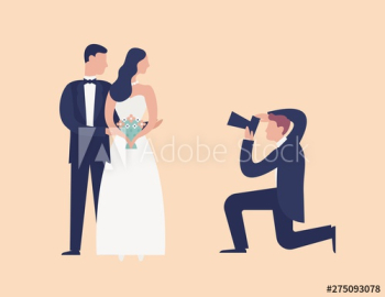 Lovely newlyweds standing together and posing for photographer shooting them Lovely newlyweds standing together and posing for photographer shooting them