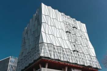 Low-angle Photography of Abstract-styled White Building Under Calm Blue Sky