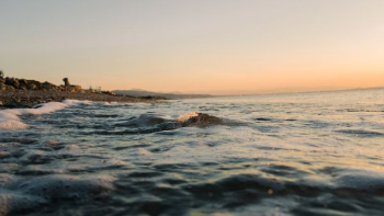 low angle photography of ocean wave at beach low angle photography of ocean wave at beach