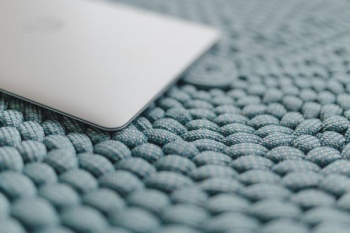 MacBook Laptop on a blue pouf MacBook Laptop on a blue pouf